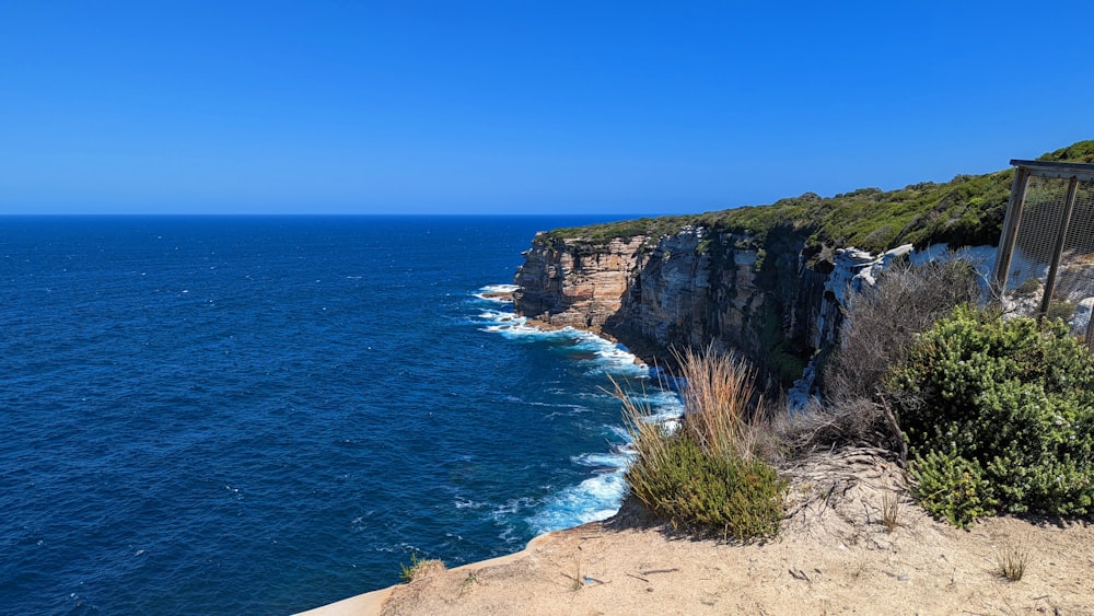 a view of the ocean from the top of a cliff