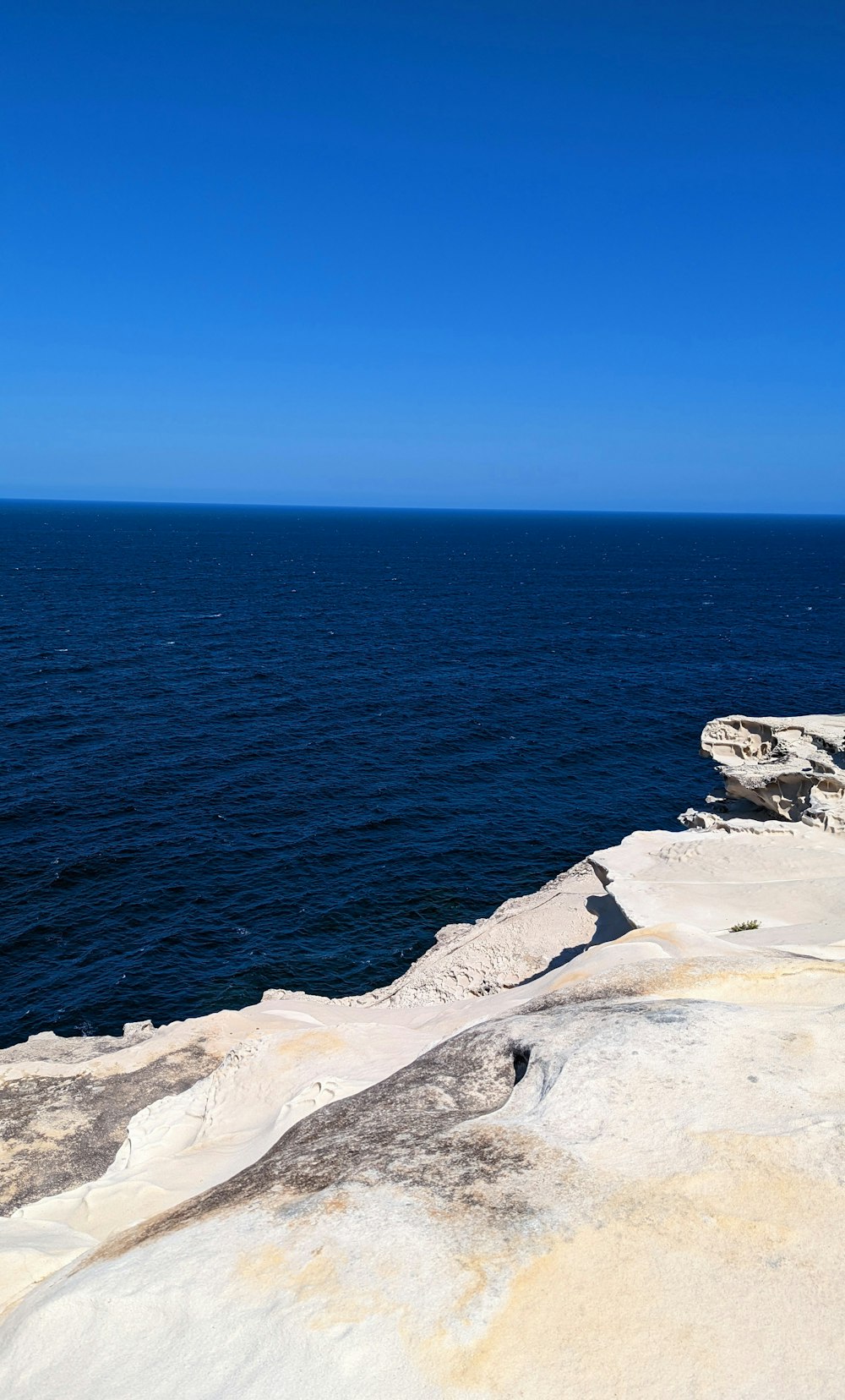 a view of a body of water from a cliff