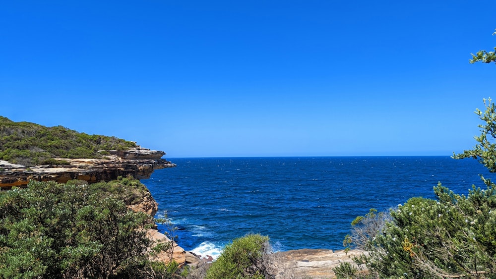 a view of a body of water from a cliff