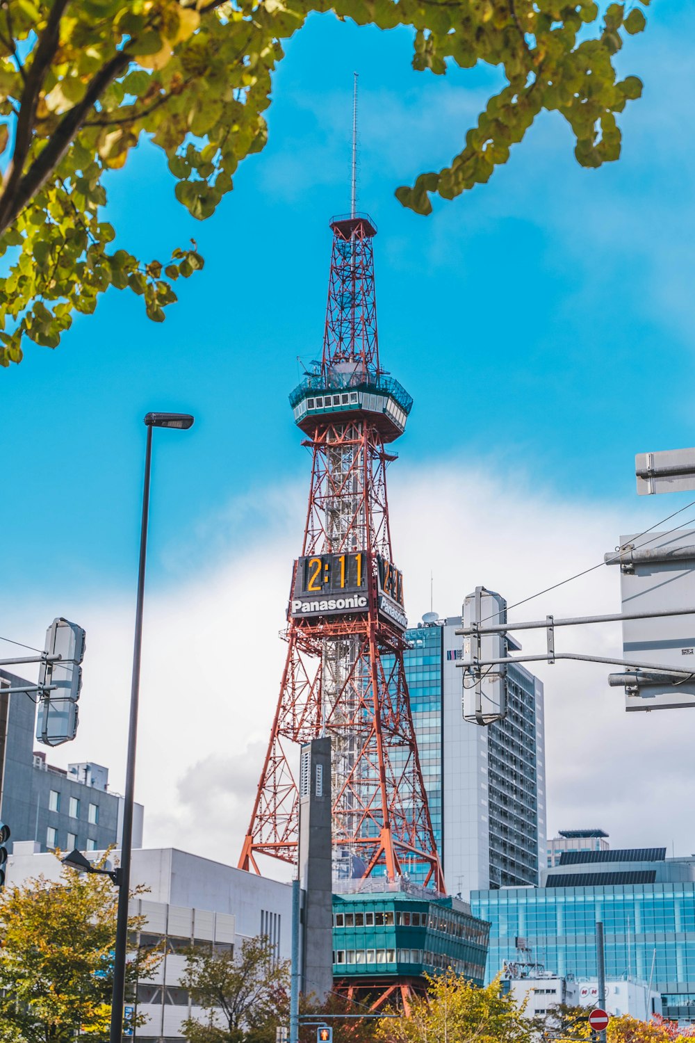 a very tall tower with a clock on it's side