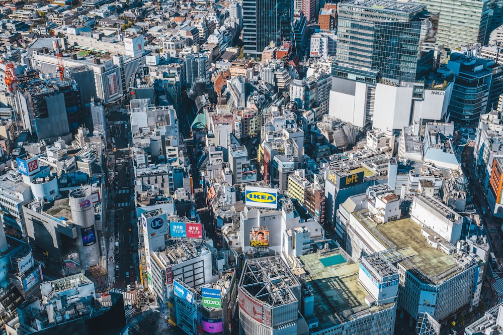 an aerial view of a city with lots of tall buildings