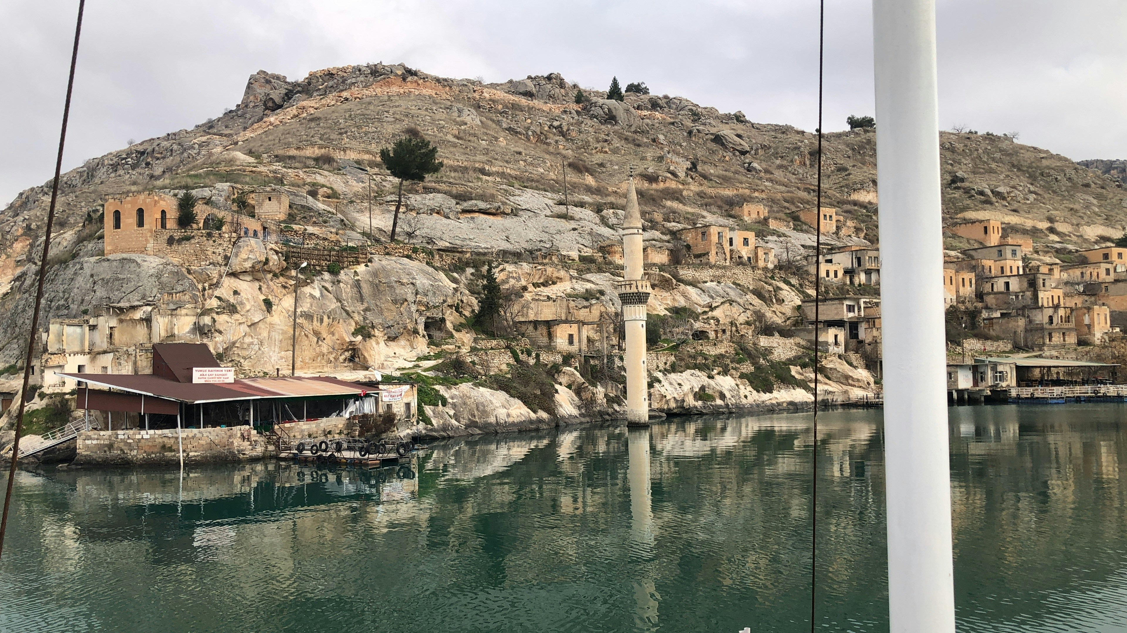a body of water with a mountain in the background