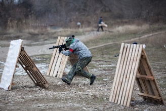 a man with a gun aims at a target