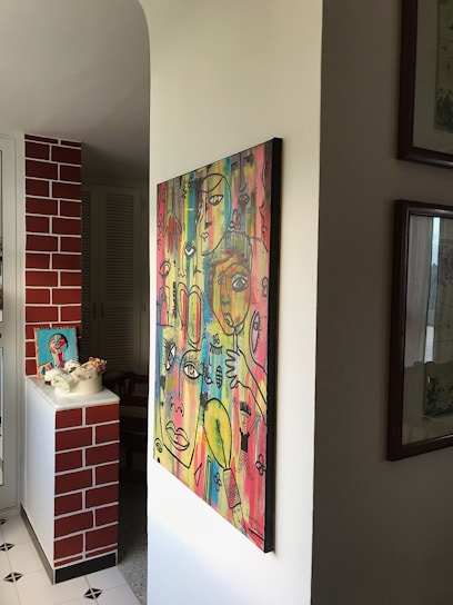 A vibrant digital painting displayed on a modern living room wall, showcasing bright colors and intricate details.