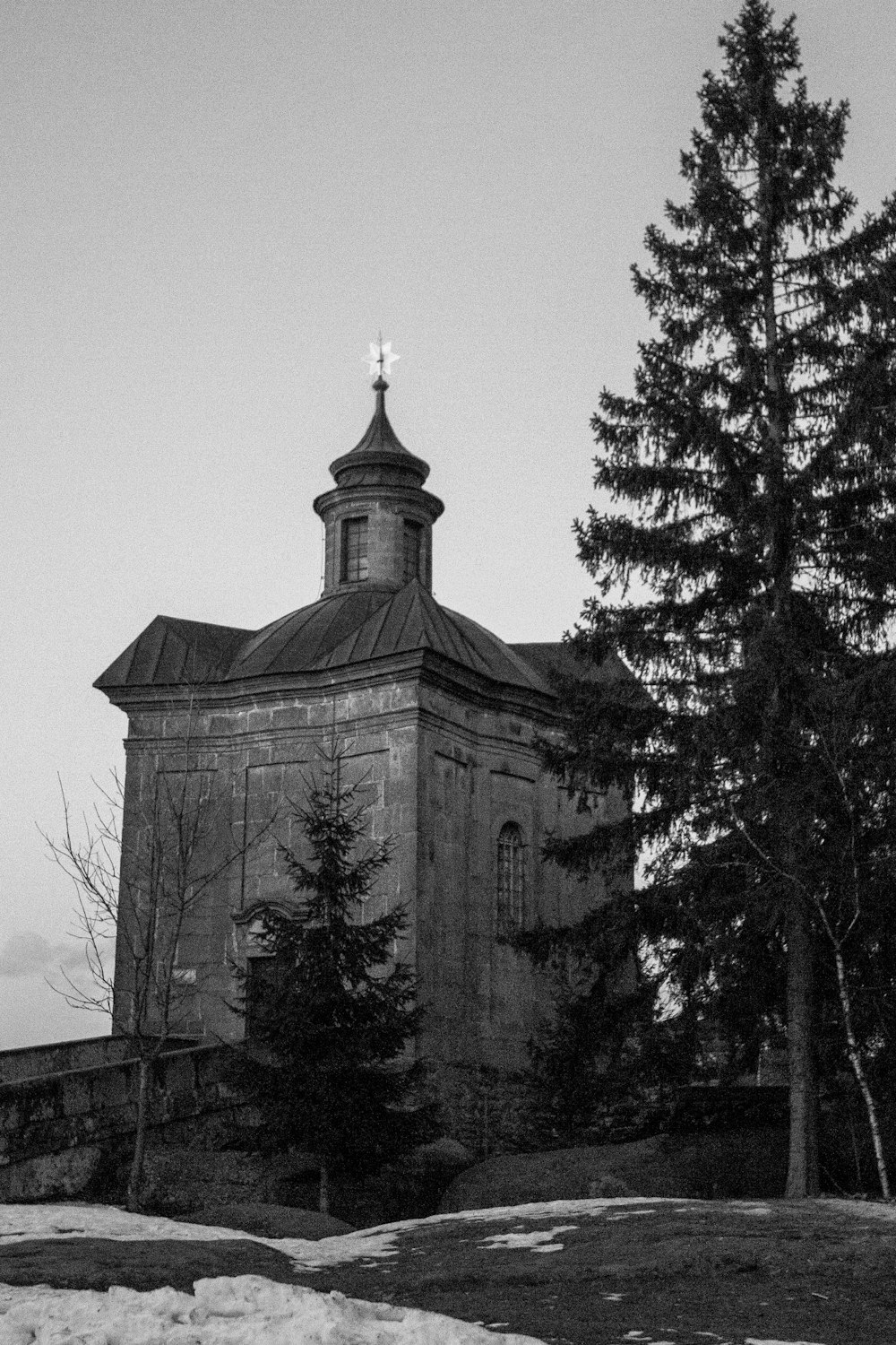 a black and white photo of a church