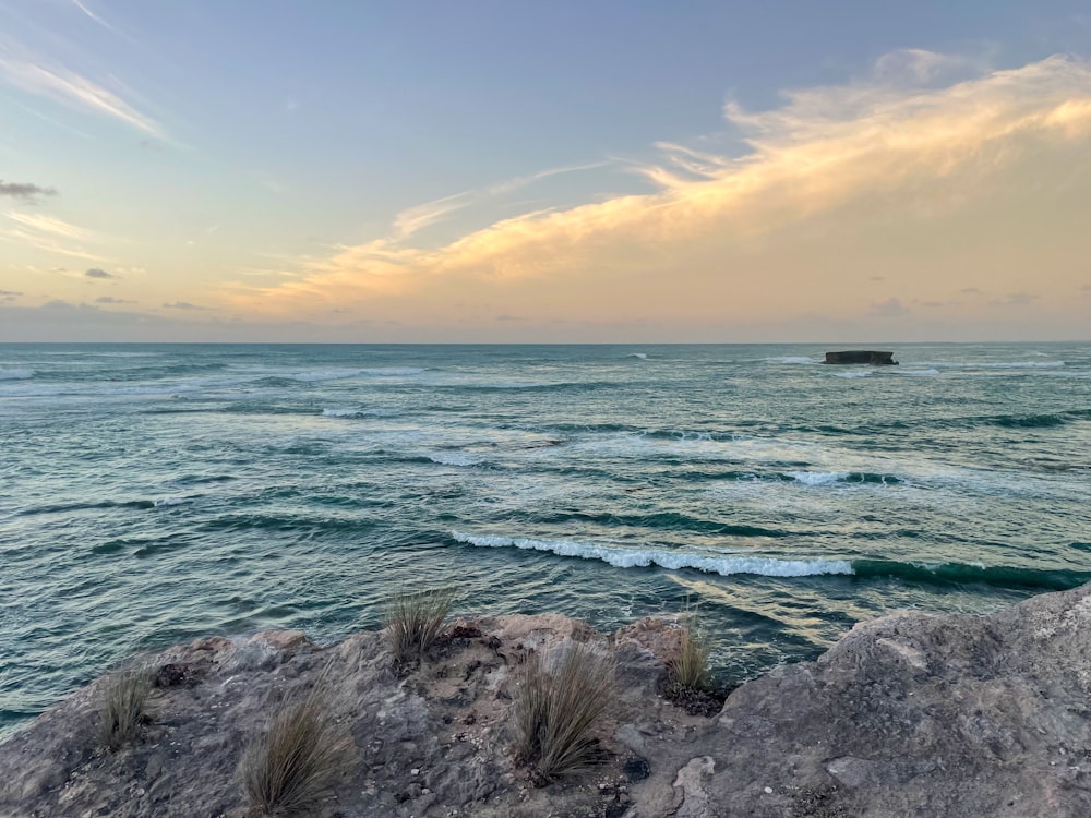 a view of the ocean from a rocky outcropping