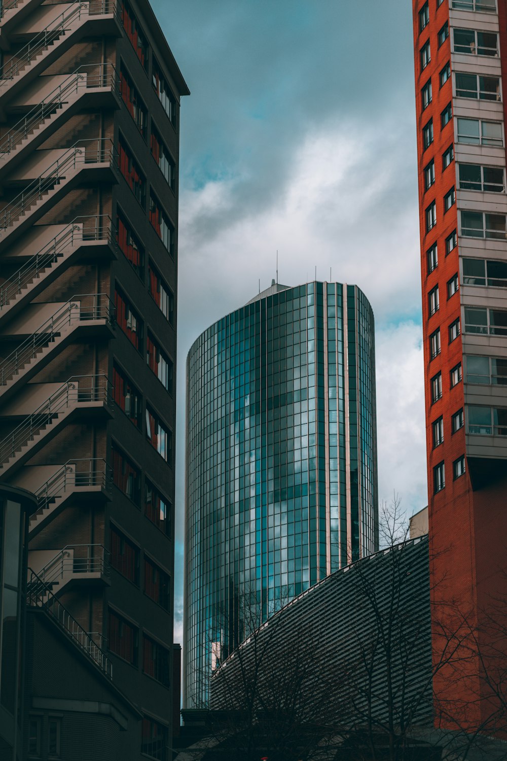 a couple of tall buildings sitting next to each other