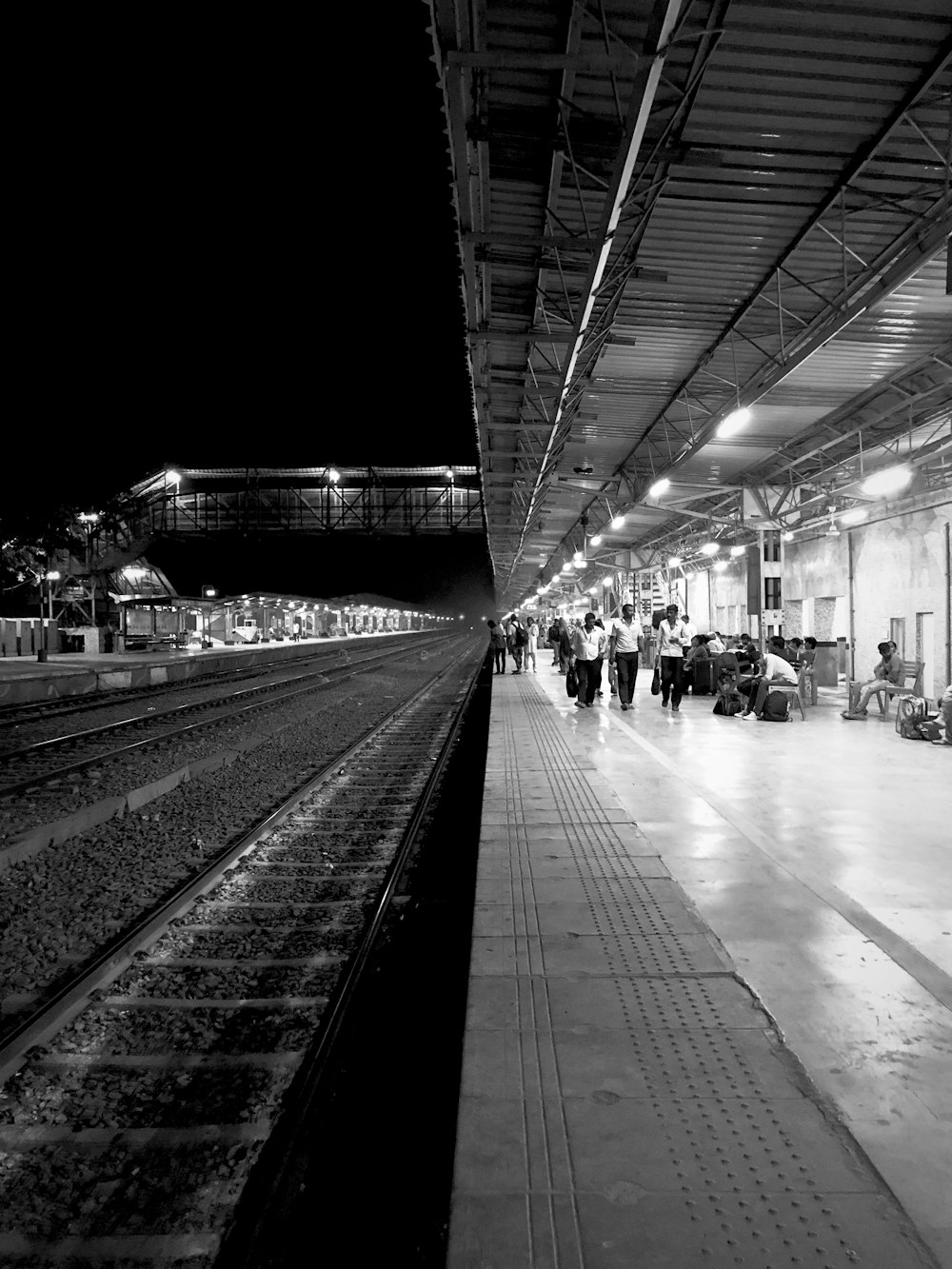 a black and white photo of a train station