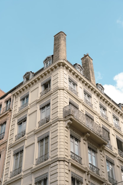 a tall building with many windows and balconies