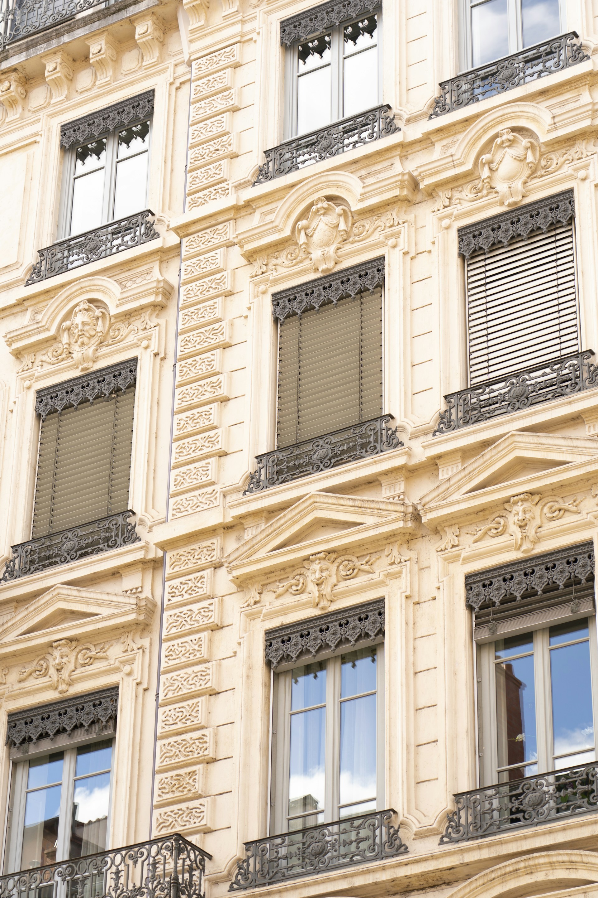 a building with many windows and a clock on the front of it
