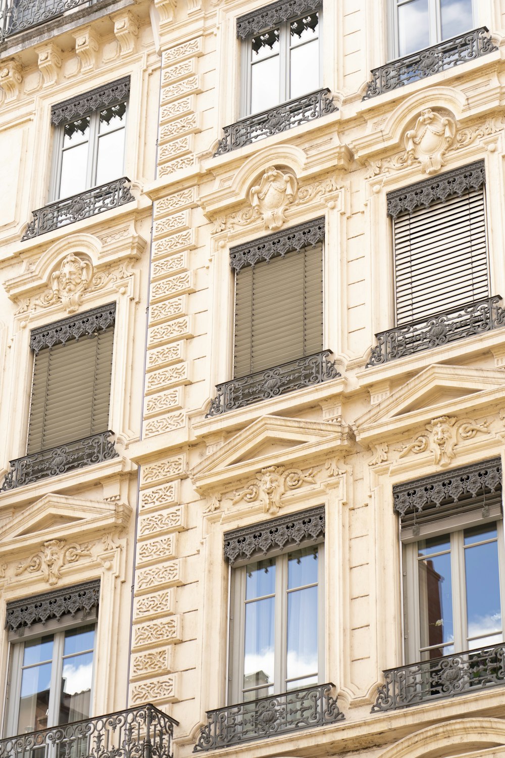 a building with many windows and a clock on the front of it