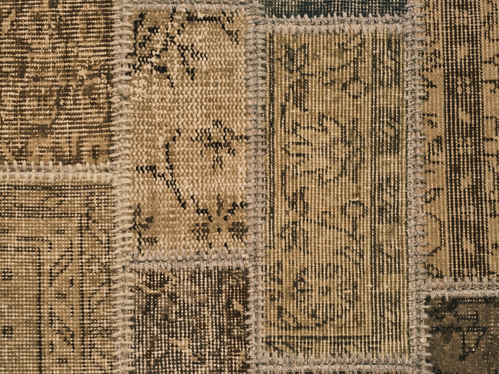 a close up of a rug with many different designs