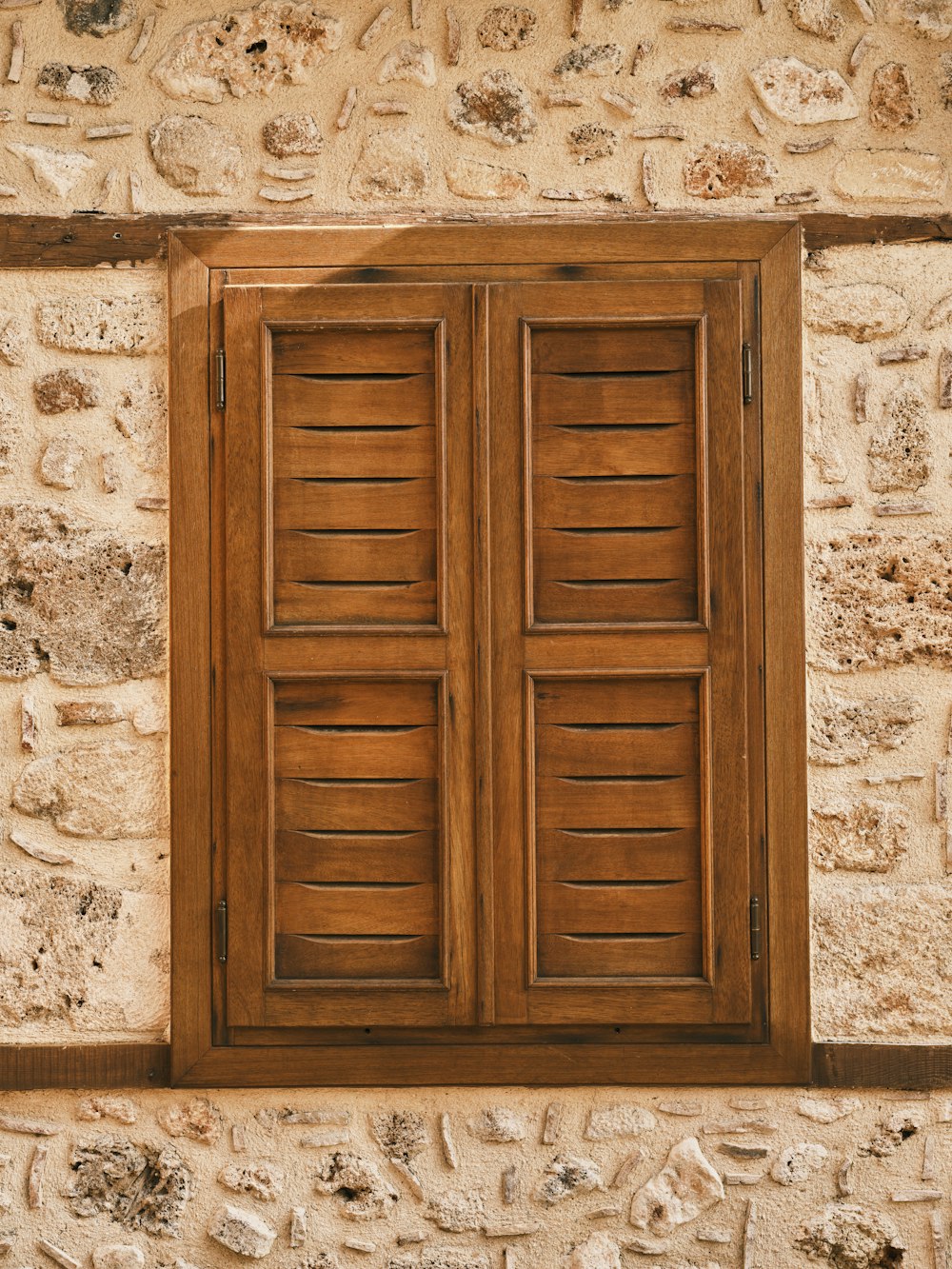 a close up of a window on a stone building