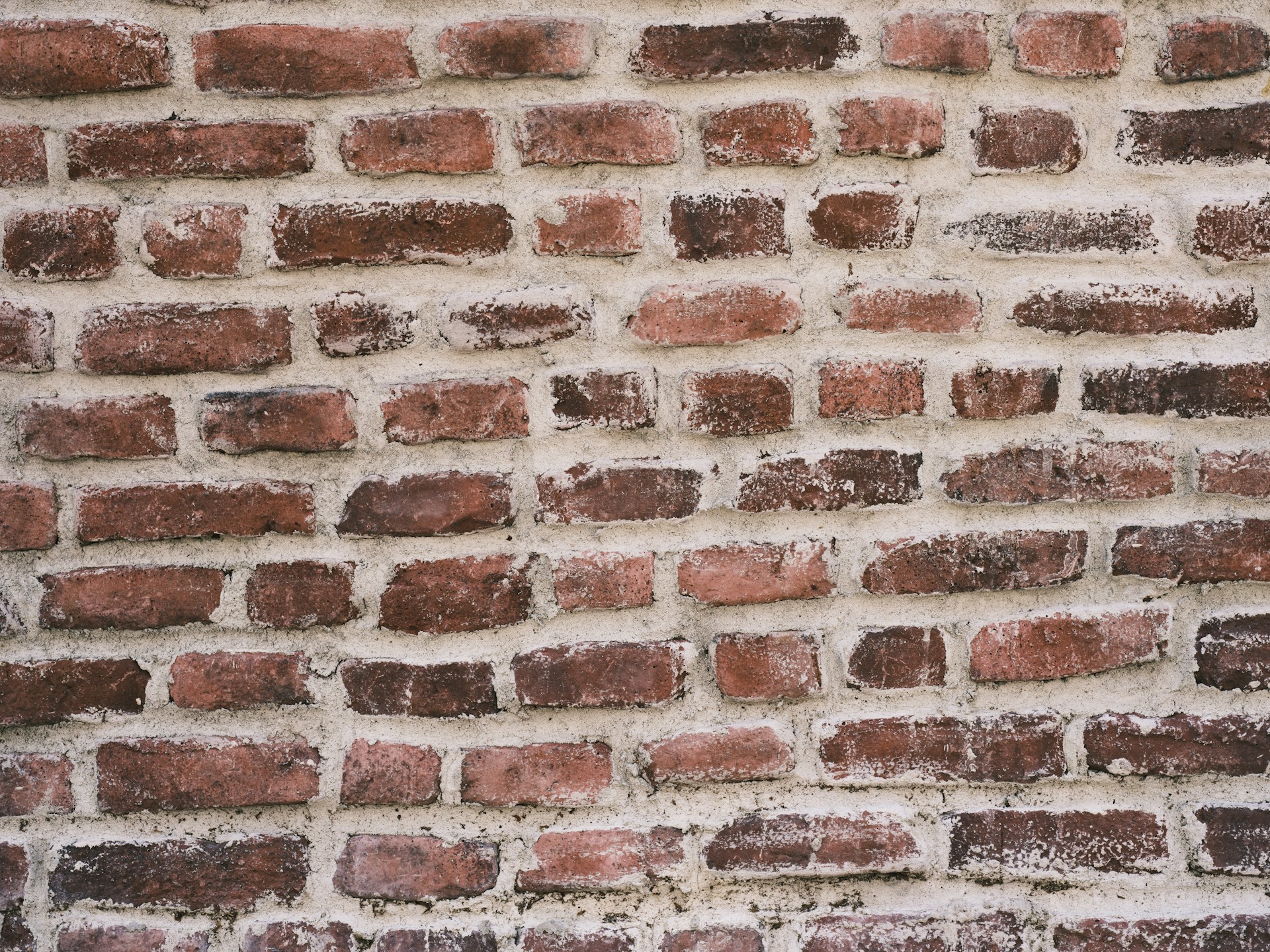 a close up of a red brick wall