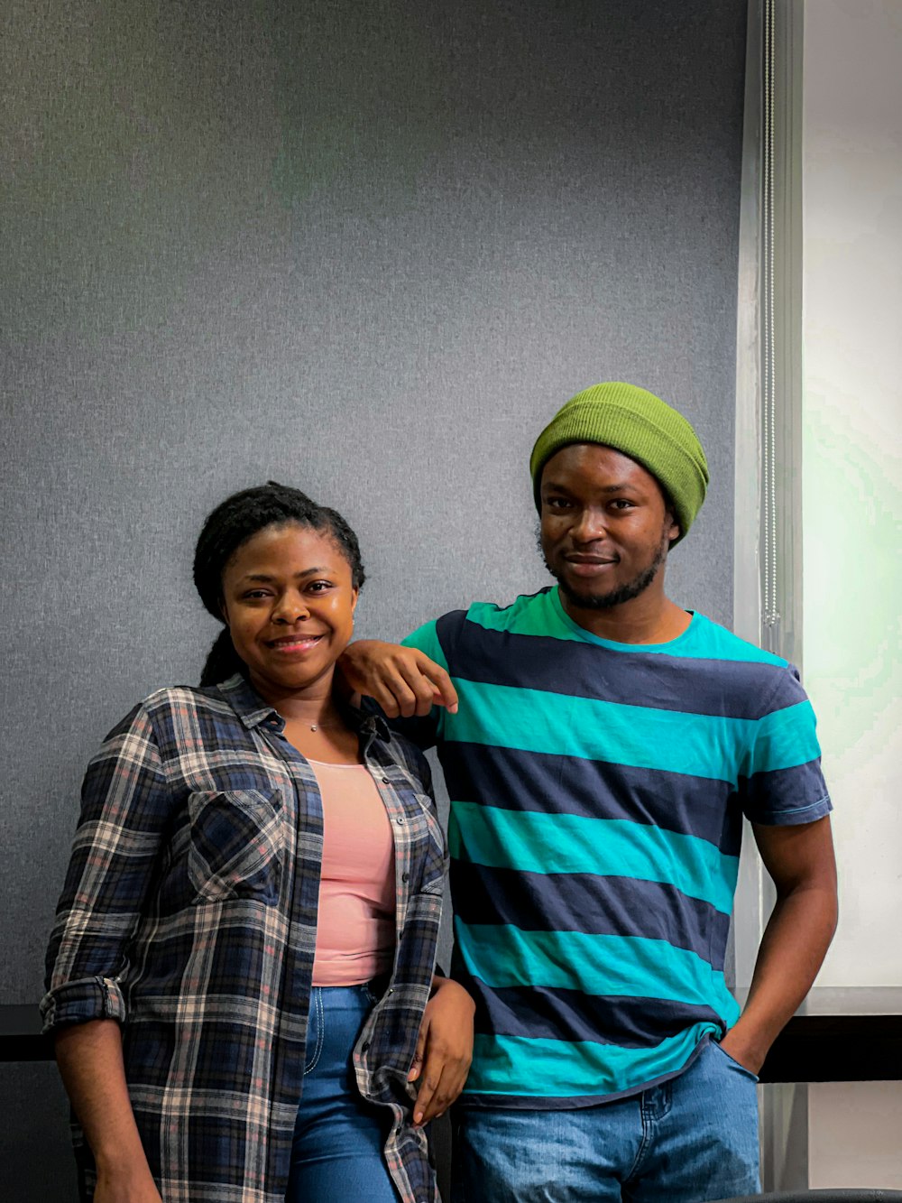 a man and a woman standing next to each other