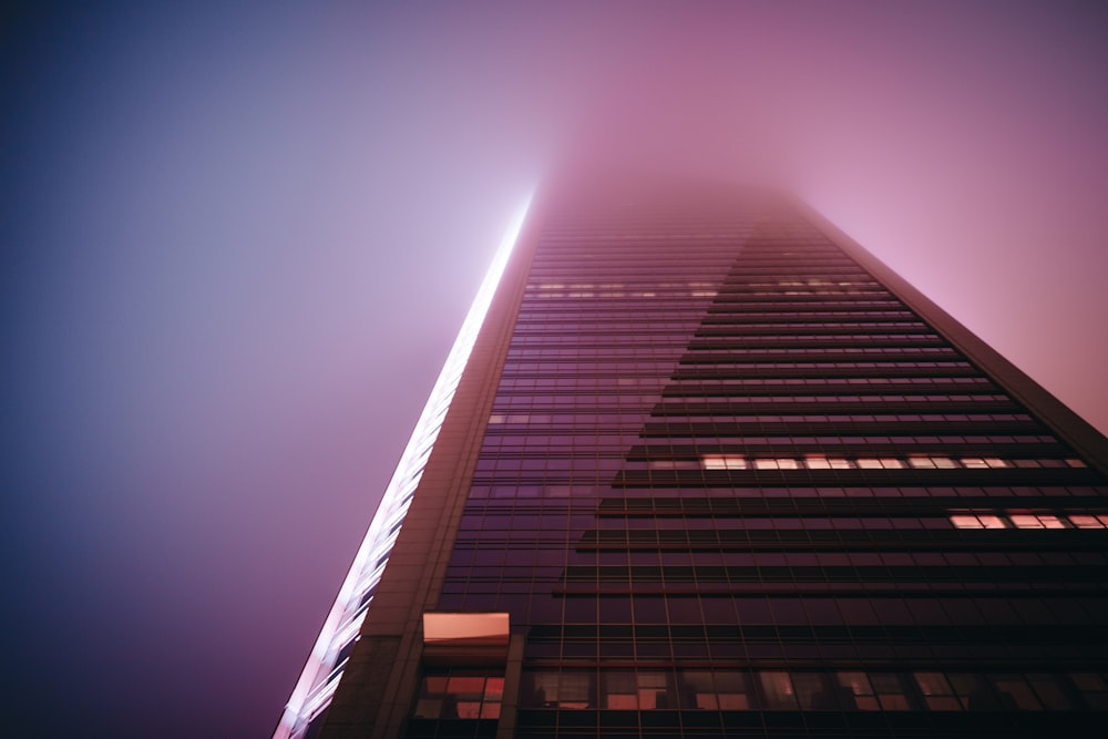 a very tall building with a very foggy sky in the background