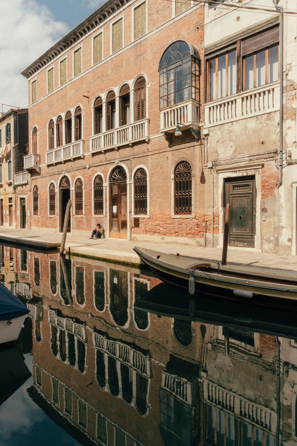 a row of buildings next to a body of water