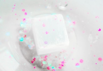 a soap bar sitting on top of a white bowl