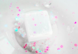 a soap bar sitting on top of a white bowl