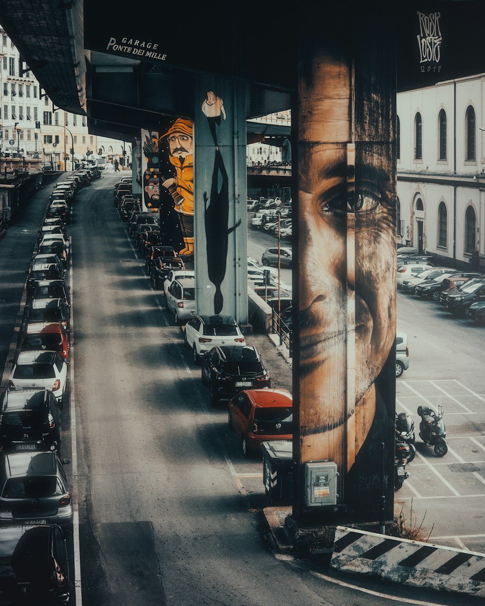 a city street filled with lots of parked cars