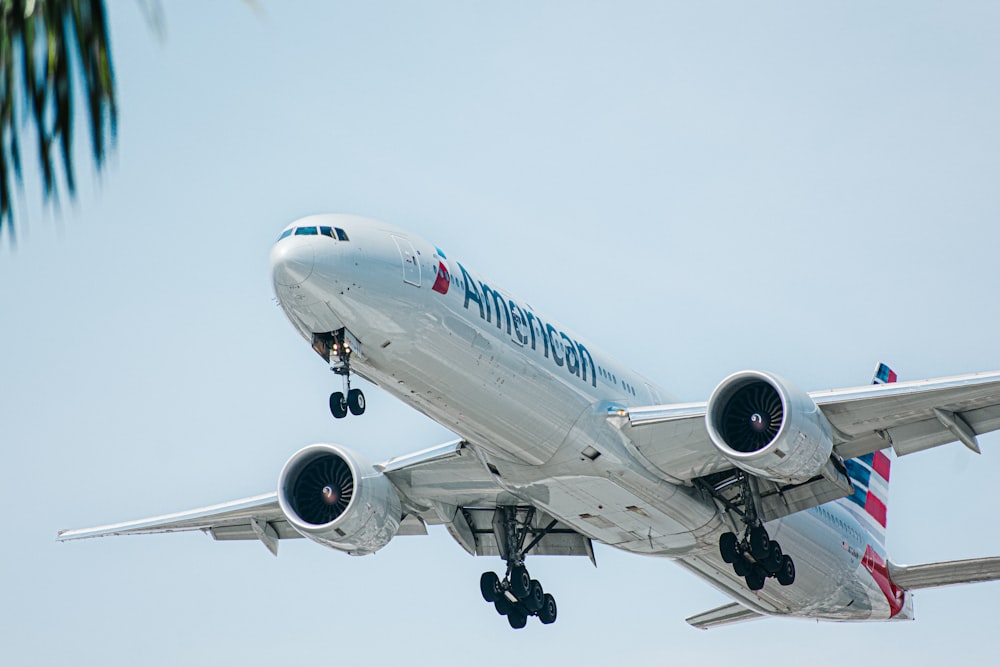 a large passenger jet flying through a blue sky