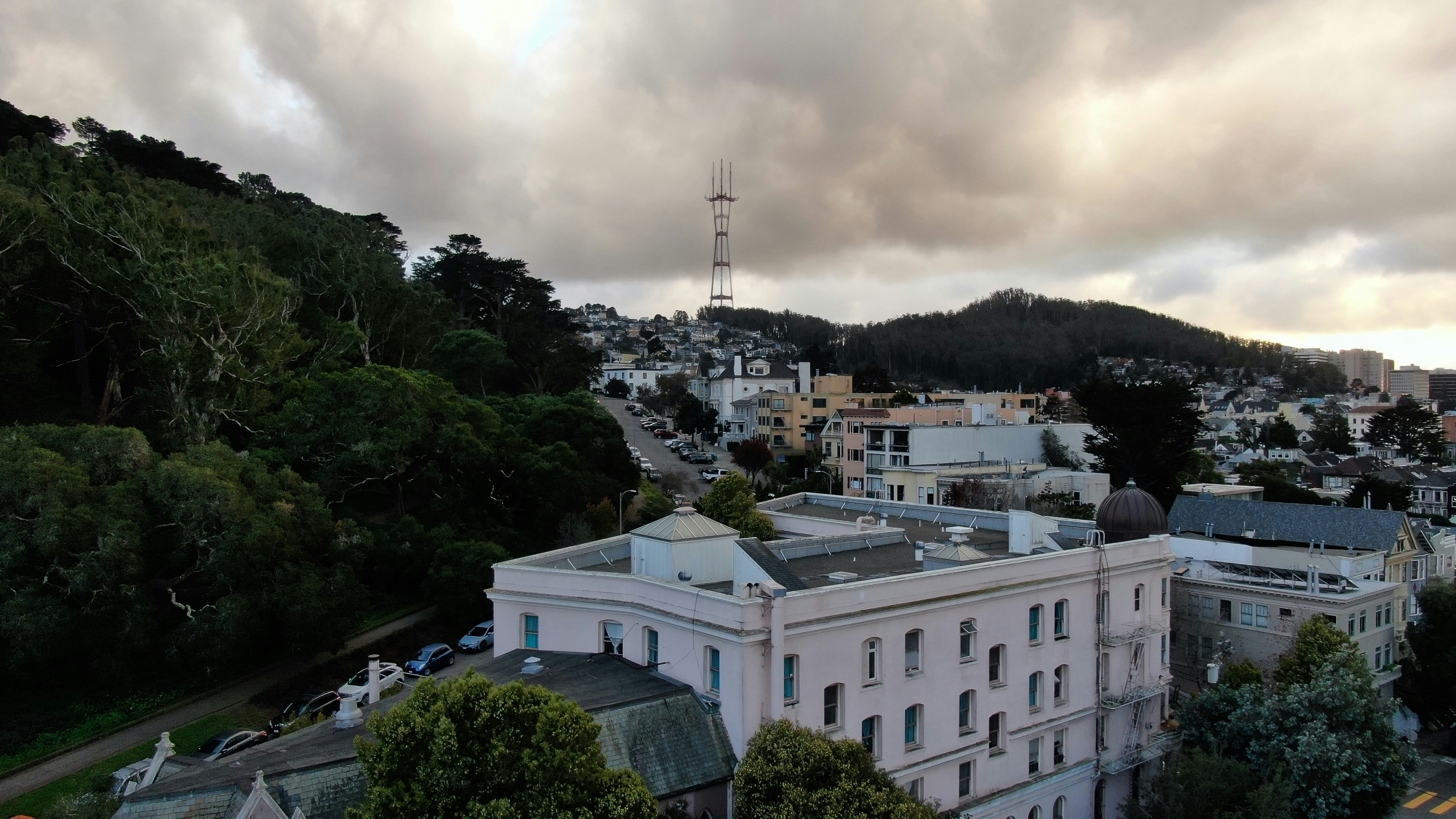 an aerial view of a city with a mountain in the background, Haight Ashbury Sutro Tower