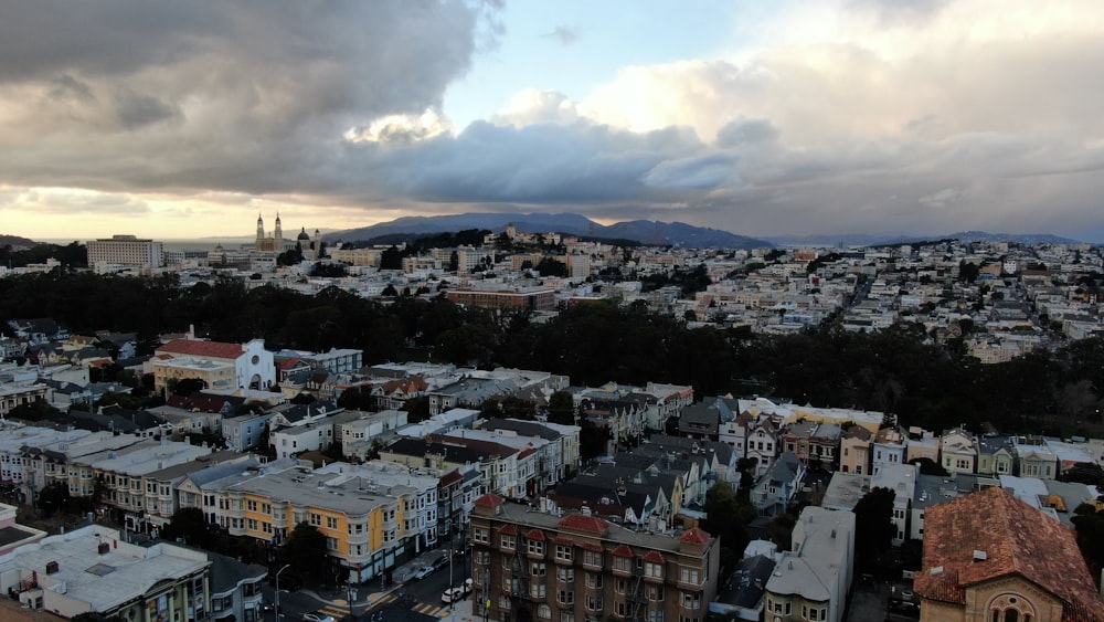 a view of a city with mountains in the background