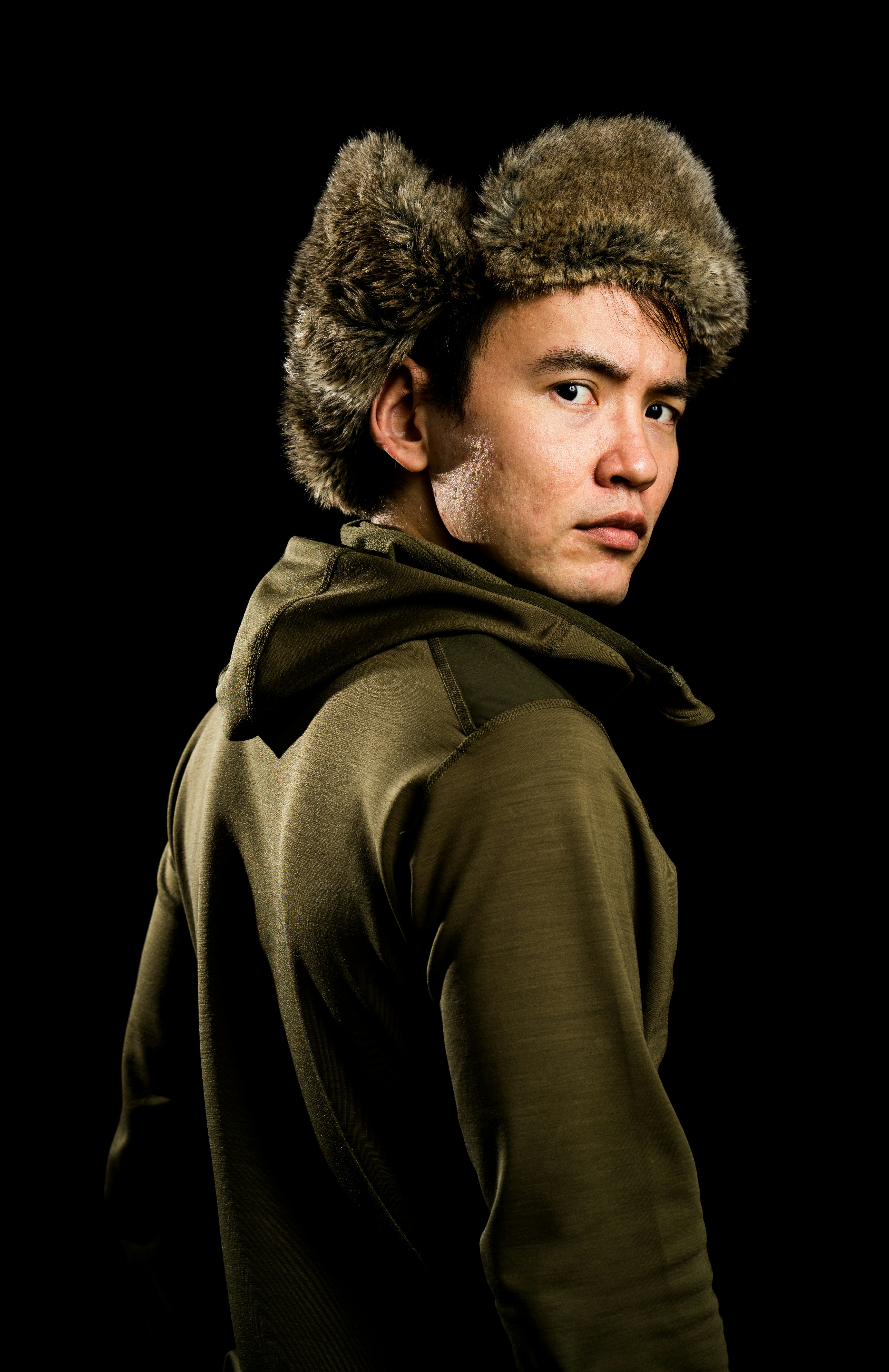 a man with a furry hat on his head