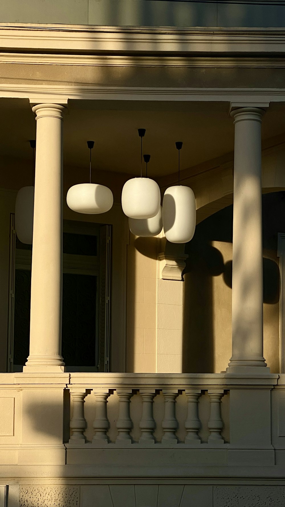 a couple of lights that are on the side of a building