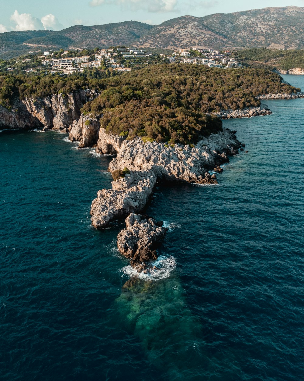 an aerial view of an island in the middle of the ocean