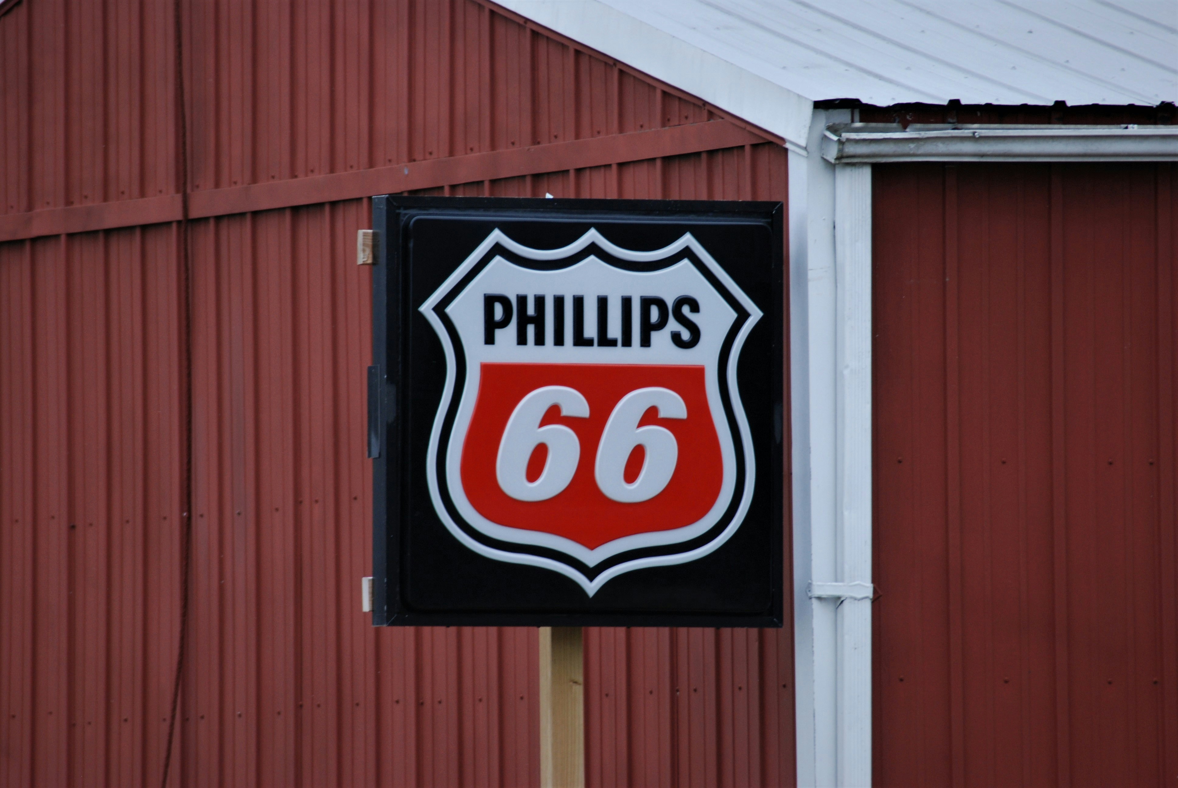 a red and black sign and a red building