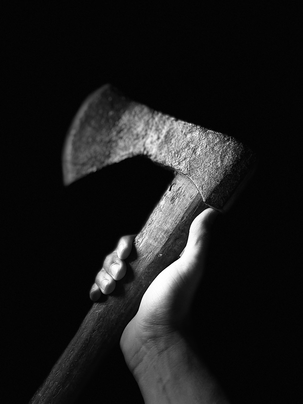 a person holding a hammer in their hand