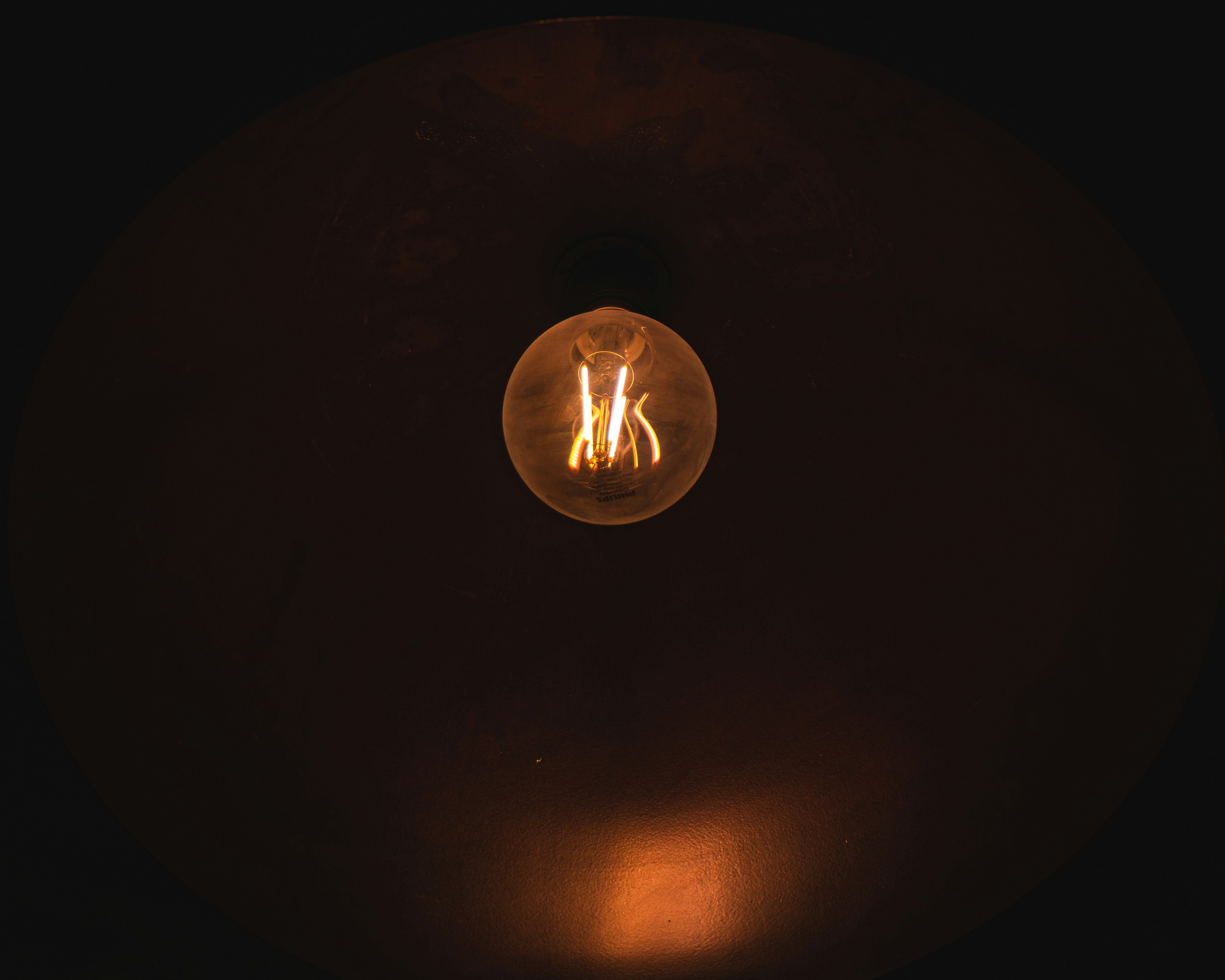 a light bulb that is lit up in the dark