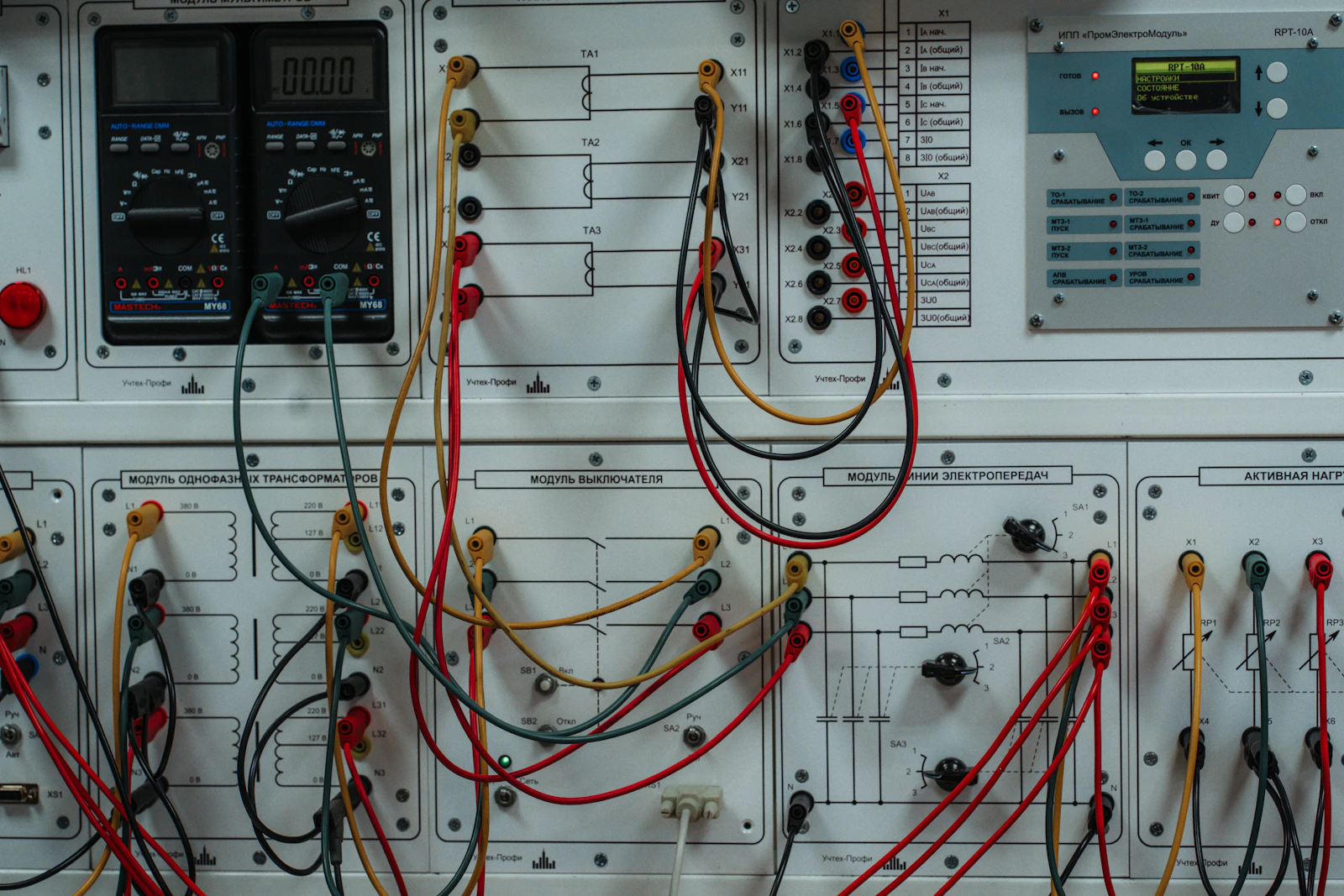 A dense bundle of wires and electrical equipment in a panel