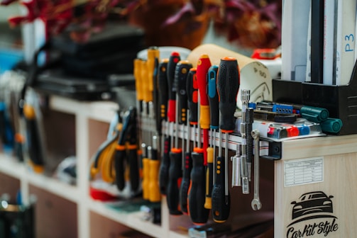 a bunch of tools that are on a shelf