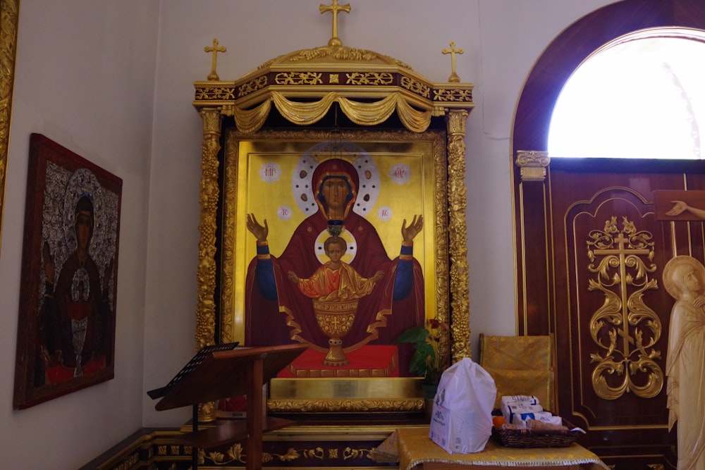 a church with a painting of a person on the alter