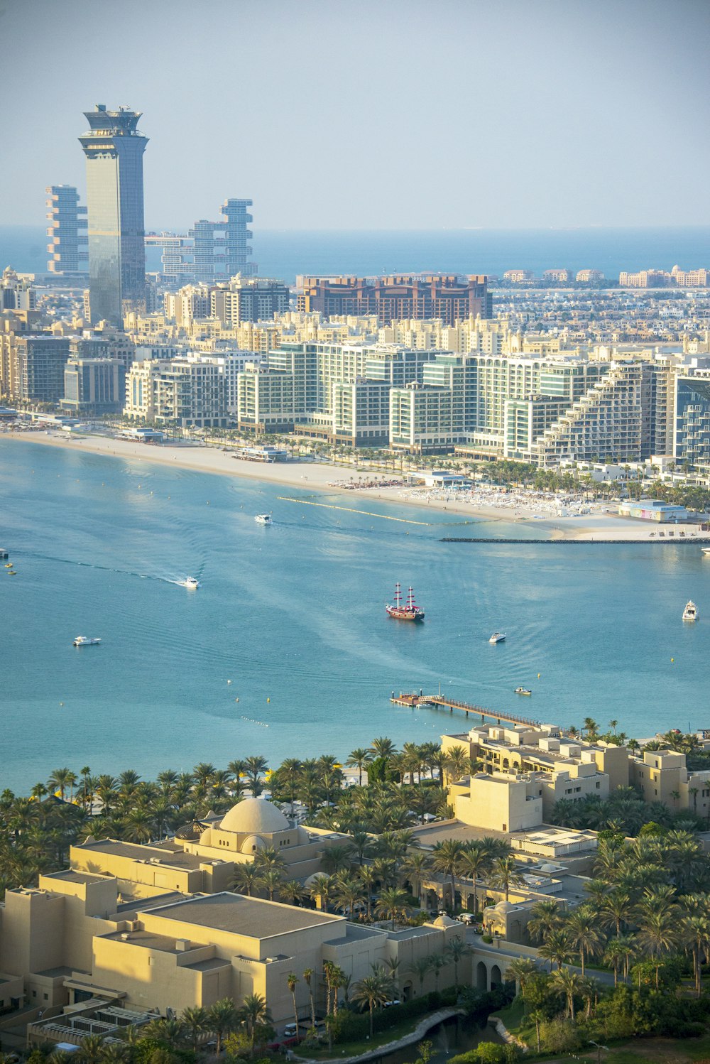 a large body of water with a city in the background