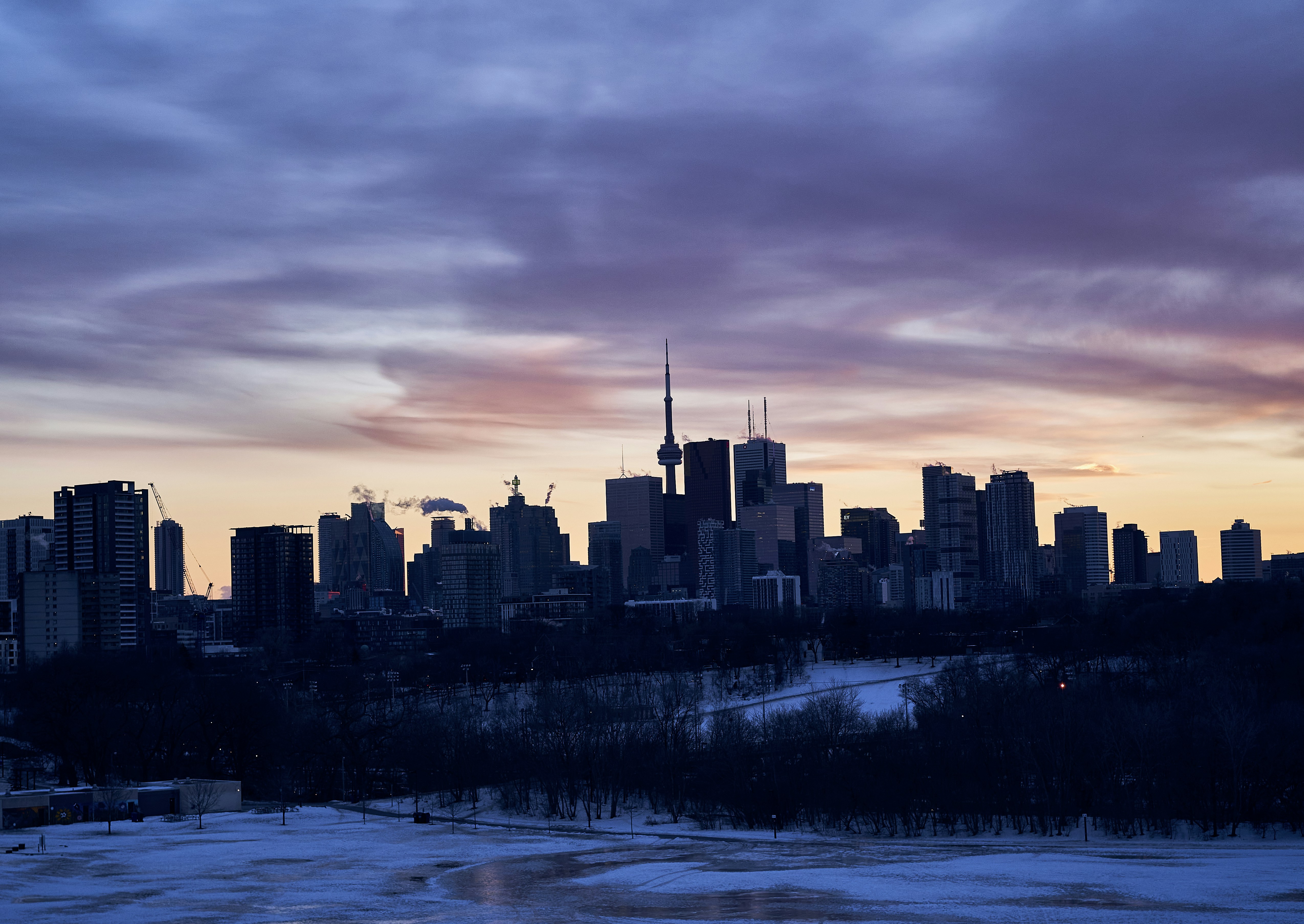 a view of a city skyline at sunset
