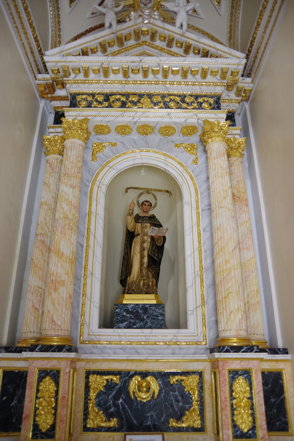a statue of a person in a church