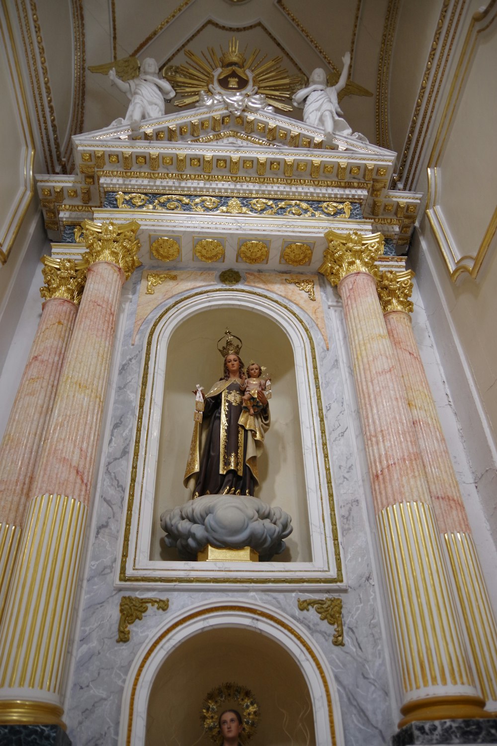 a statue of the virgin mary in a church