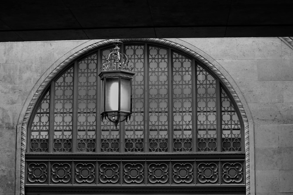 a black and white photo of a street light