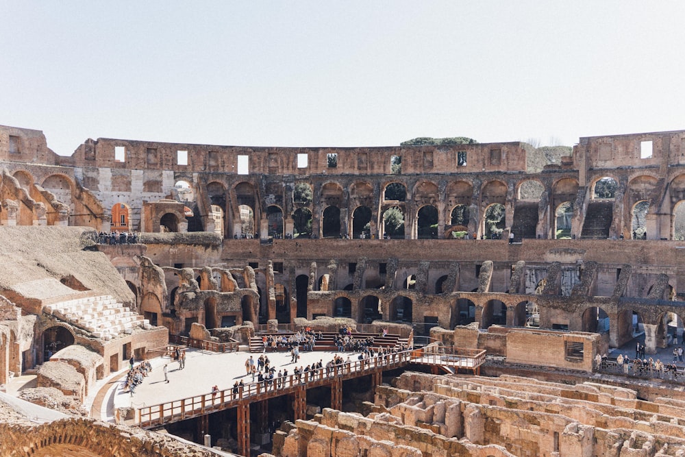 a group of people standing inside of an old building