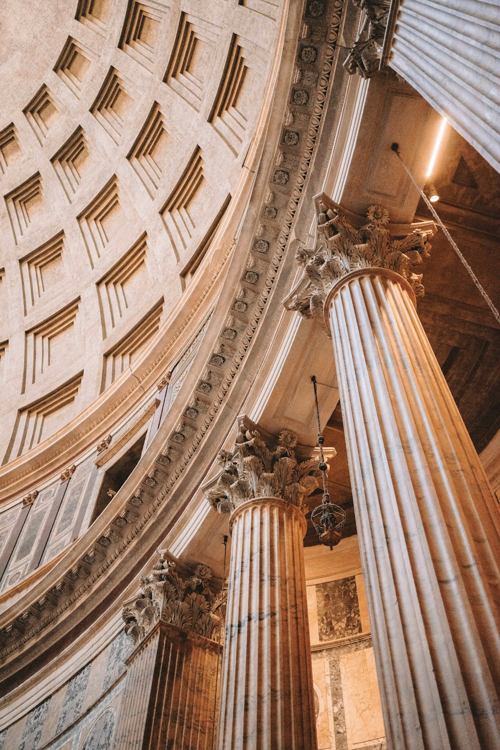 the ceiling of a large building with columns