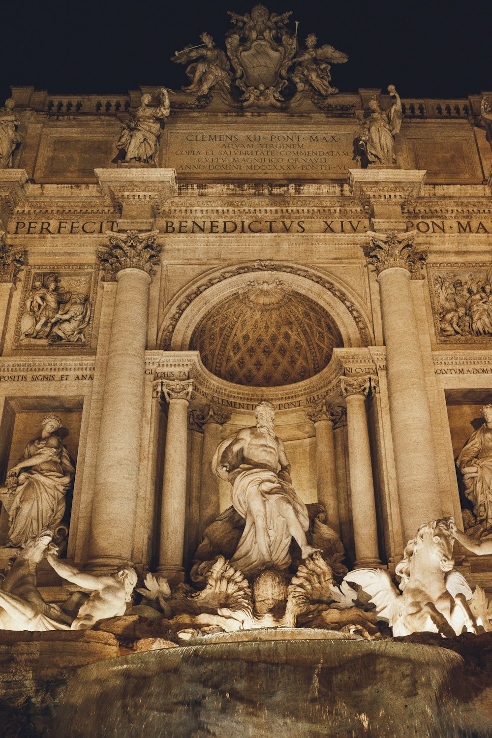 a statue of a man on a horse in front of a building