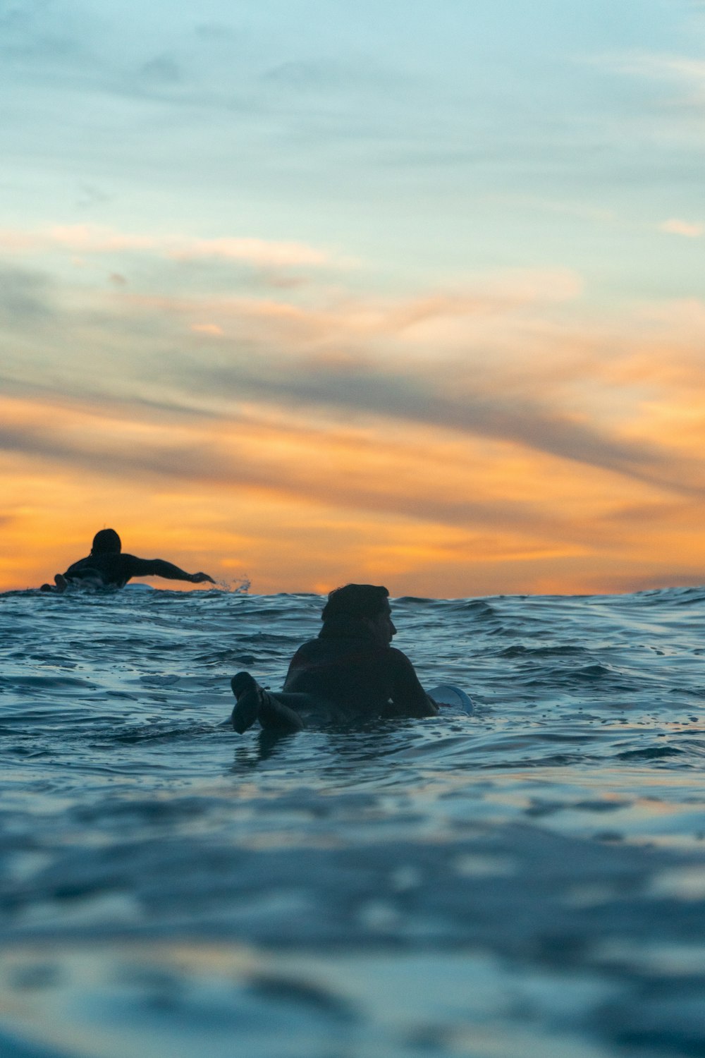 a person riding a surfboard on a wave in the ocean