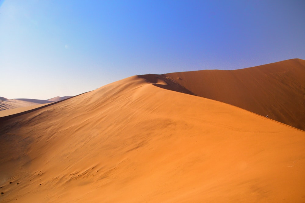 a large sand dune in the middle of a desert