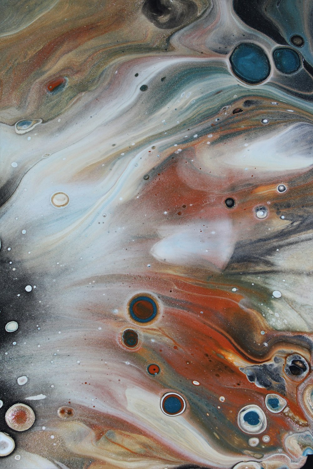 a close up of a painting with lots of bubbles