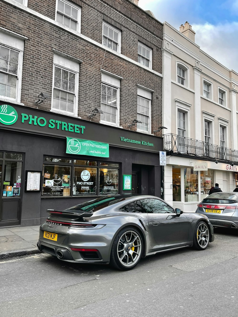 two cars parked on the side of the street