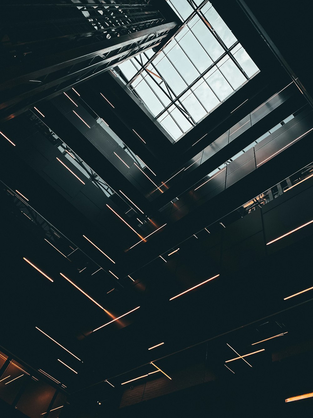 the ceiling of a building with a skylight above it