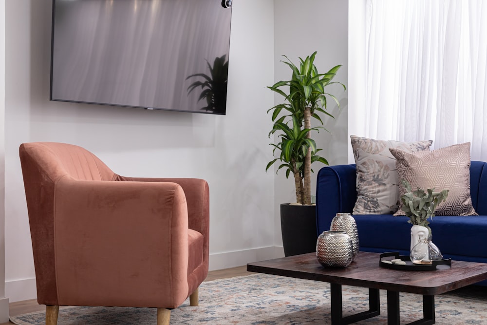 a living room filled with furniture and a flat screen tv